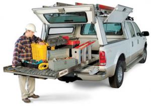 a Homestead irrigation repair tech is unloading the equipment from the truck